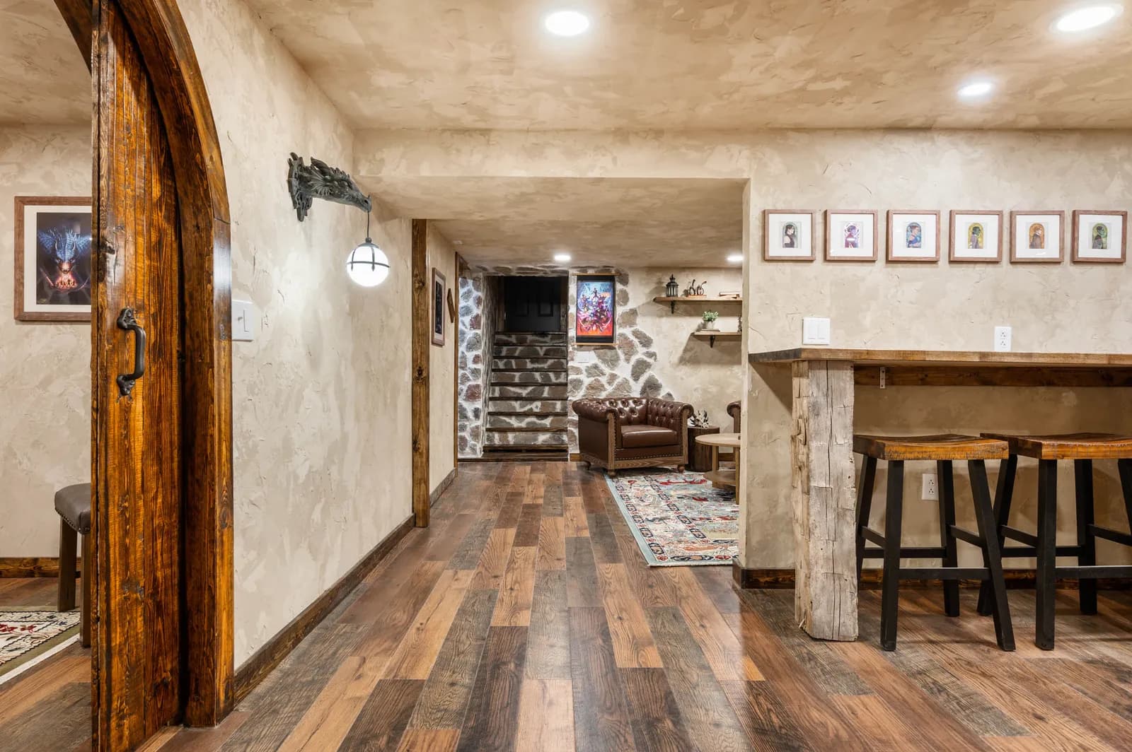 The lounge at D20 Dungeon, with framed art along a plastered wall