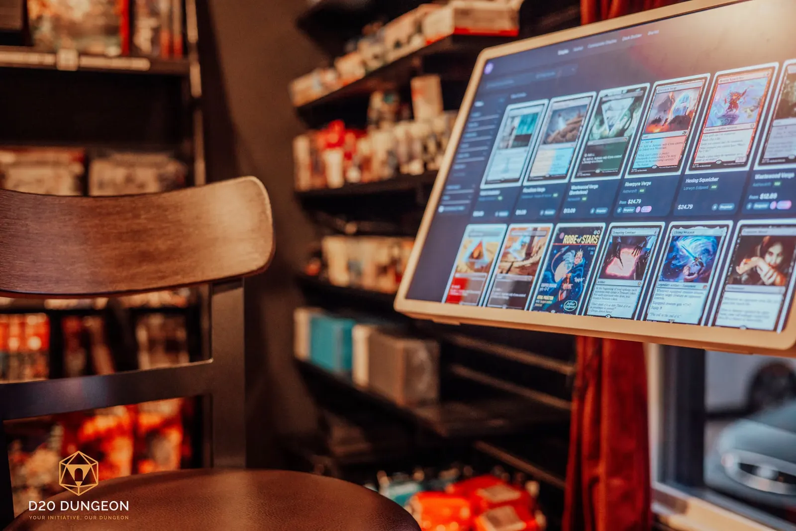 A singles browsing kiosk in the shop, showing Magic cards on screen